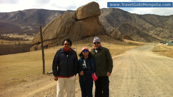 our customers are standing in front of Turtle Rock at Gorkhi-Terelj National Park