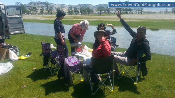 our customers are enjoying picnic lunch around Tsengel village during Altai tour.