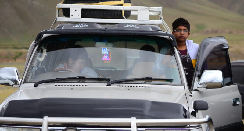 Our director, Ganzo, was traveling with his car. With a little traveler boy from India