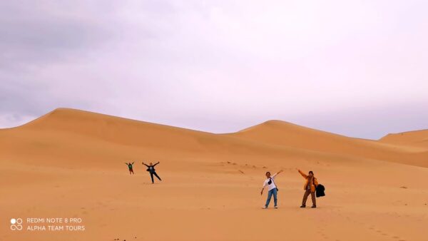 Vietnamese group travelers in Khongor Sand Dune. 